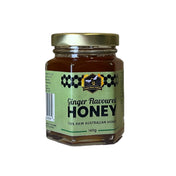 Jar of ginger-flavored honey on a white background